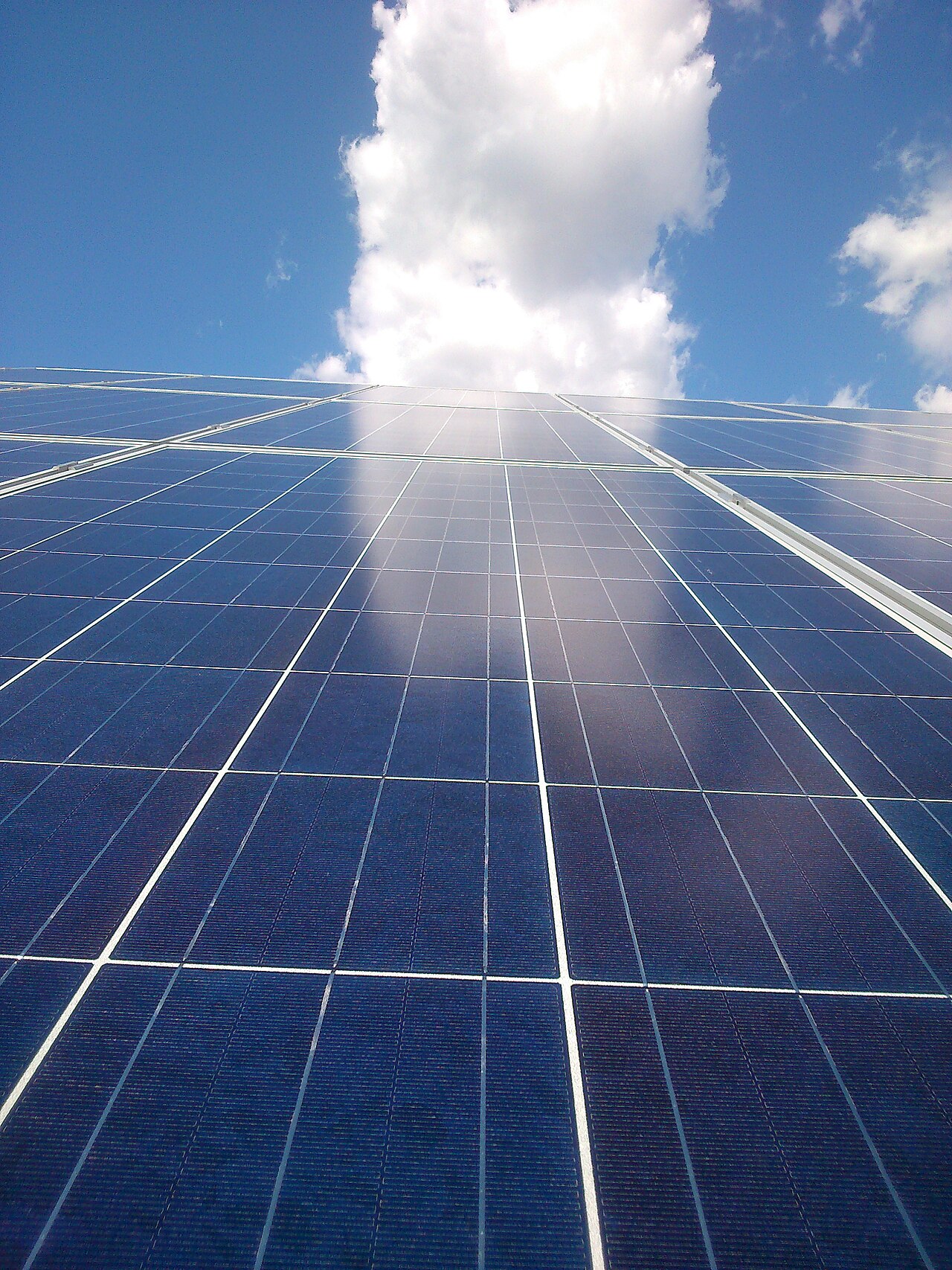 Close-up of a solar panel's sealed glass and silicon-cell surface